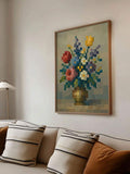 Framed pixel mosaic floral still life above a cream sofa with striped cushions