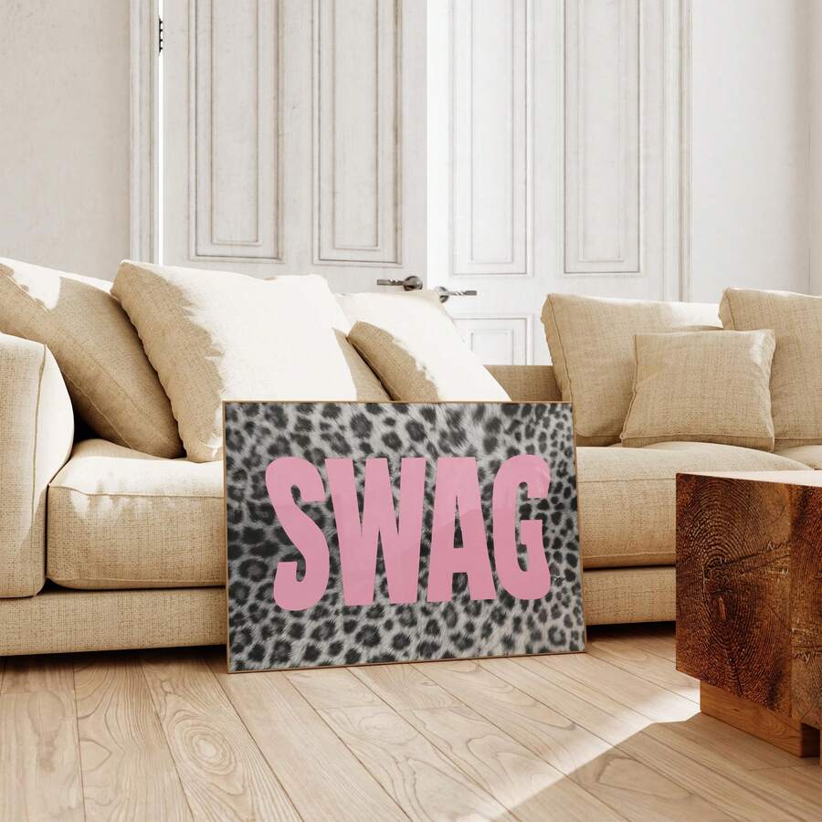 Pink SWAG leopard typography poster leaning beside a neutral sectional sofa