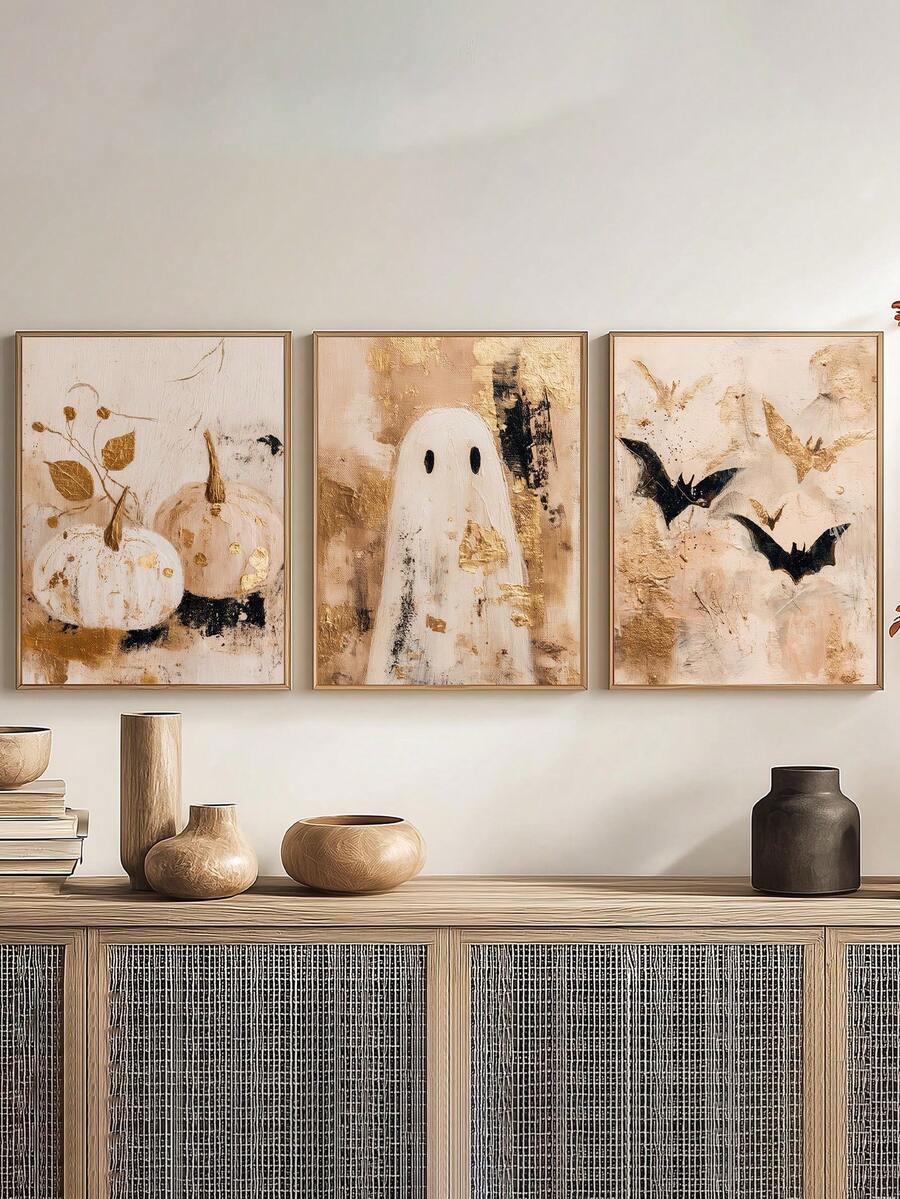 Framed pumpkin ghost and bat Halloween art trio above a bench