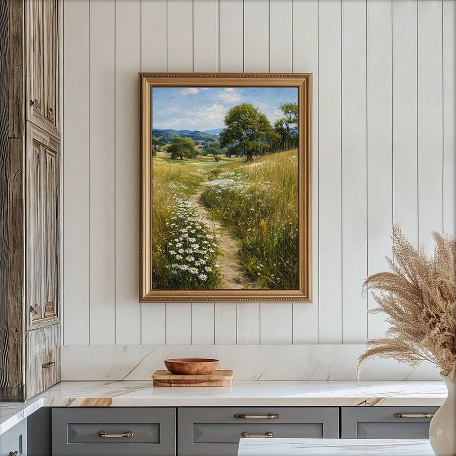 Gold framed rural wildflower landscape print styled in a rustic kitchen