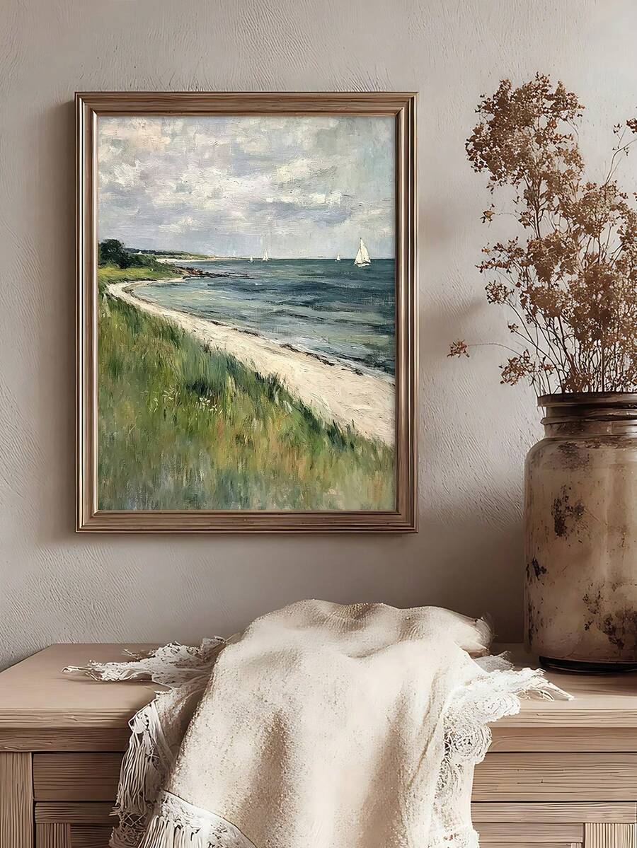 Sailboat beach and grassy dunes artwork above a rustic console