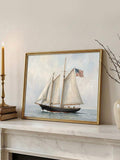 Vintage sailing ship at sea displayed in an ornate gold frame