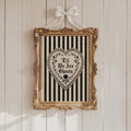 Gothic floral heart poster displayed over an antique mantel