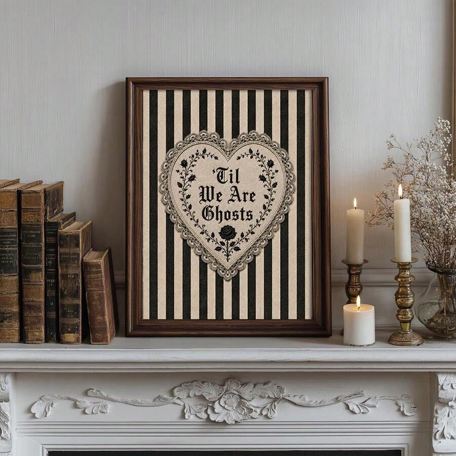 Dark wood framed gothic romance quote art above a console