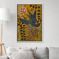 Mustard yellow botanical wall art with blue leaves above a gray sofa