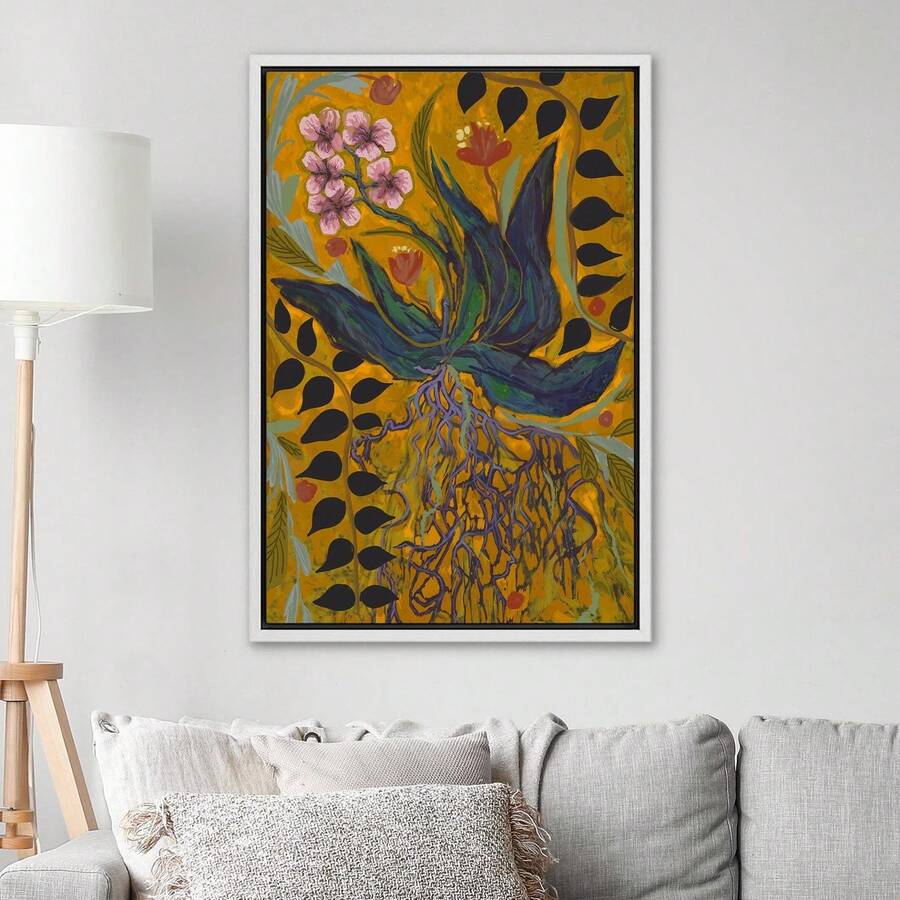 Mustard yellow botanical wall art with blue leaves above a gray sofa
