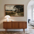 Country cottage landscape above a wood console
