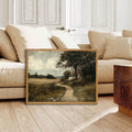 Pastoral cottage canvas displayed near a neutral sofa