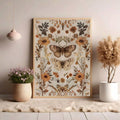 Vintage botanical moth poster leaning in a neutral rustic interior