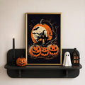 Gold-framed Halloween haunted house print on a black wall shelf