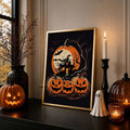 Gold-framed Halloween haunted house print on a candlelit mantel