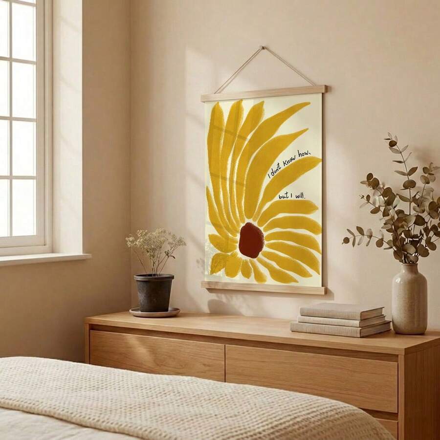 Mustard sunflower quote canvas hanging above an oak bedroom dresser with dried stems