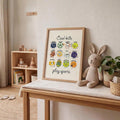 Cartoon sports ball artwork displayed above a low shelf beside children’s clothing