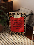 Red leopard motivational wall art styled in a modern office lounge