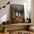 Halloween canvas poster on a wooden console with pumpkins and hanging bat decor
