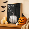 Halloween pumpkin canvas poster displayed on a mantel with bats and jack-o-lanterns