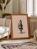 Framed book lover line art poster styled on a warm wood floor