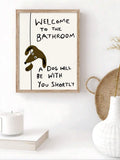 Natural wood framed dog bathroom sign in a neutral bathroom