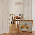 Vintage animal race car poster displayed on a sunlit wall shelf