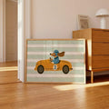 Whimsical dog racing artwork leaning beside a home office desk