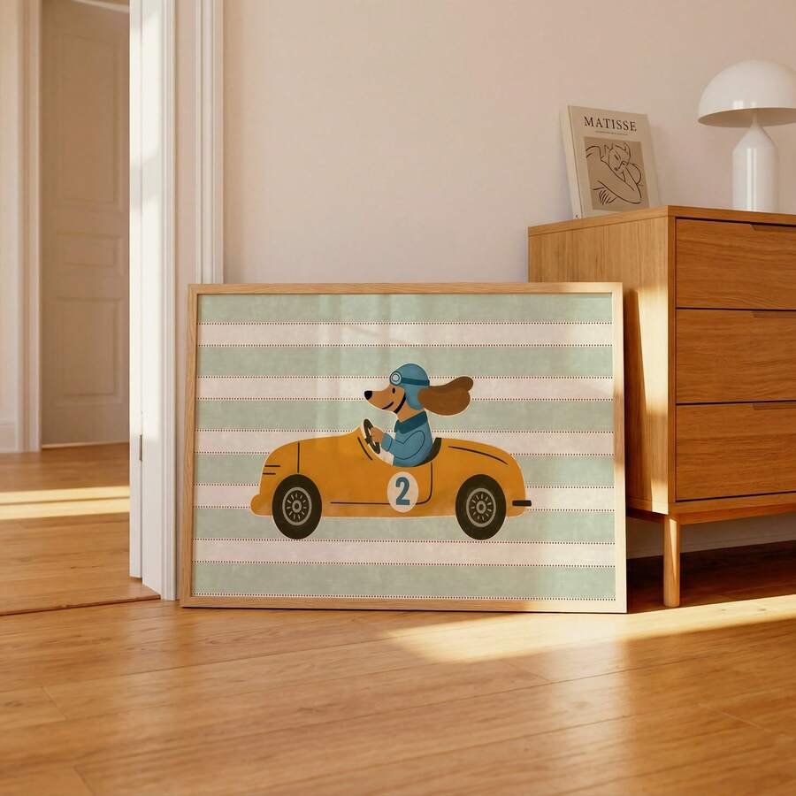 Whimsical dog racing artwork leaning beside a home office desk