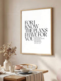 Framed Jeremiah scripture wall art above a neutral dining table