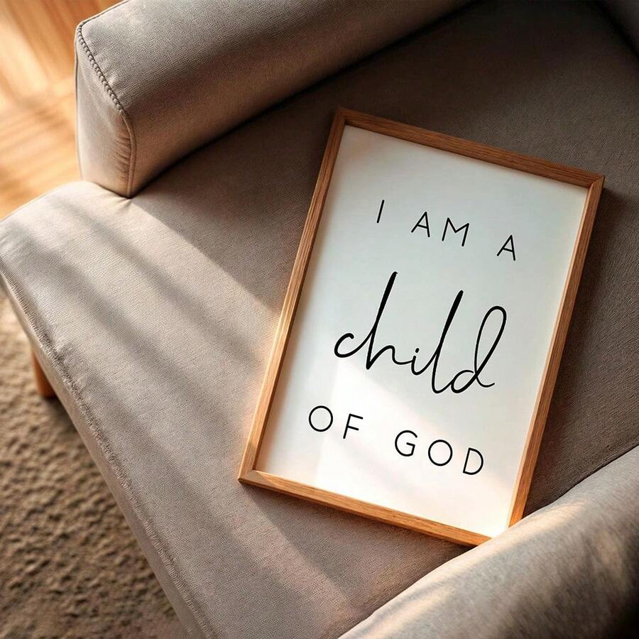 Framed I Am a Child of God print on a sunlit cream wall