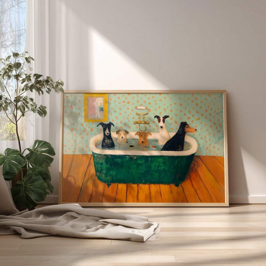 Framed dogs bathing artwork on the floor beside a leafy plant