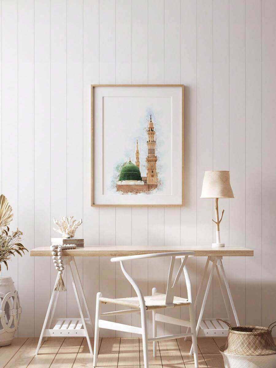 Framed green dome mosque watercolor poster above a home office desk