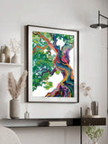 Rainbow-barked tree artwork in a dark wood frame in a modern living room