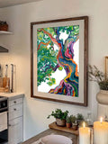 Vibrant tree wall art in a rustic wood frame above a kitchen counter