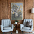 Framed misty forest watercolor wall art above chairs in a wood-paneled room