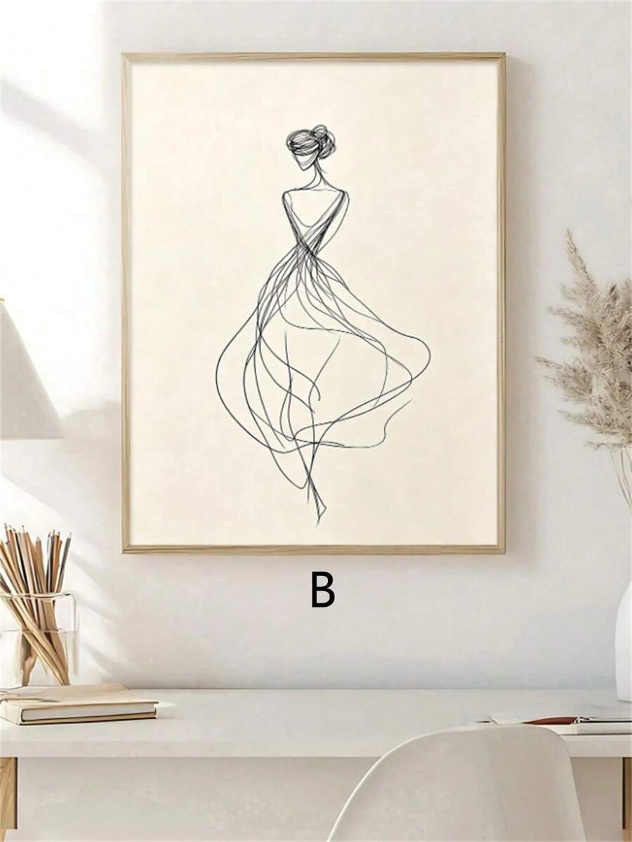 Framed abstract female portrait styled in a modern home office