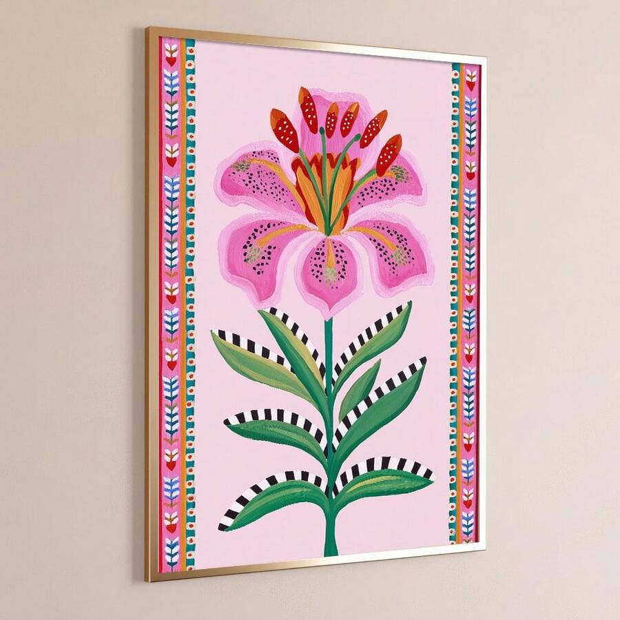 Angled framed botanical lily artwork on a warm neutral wall