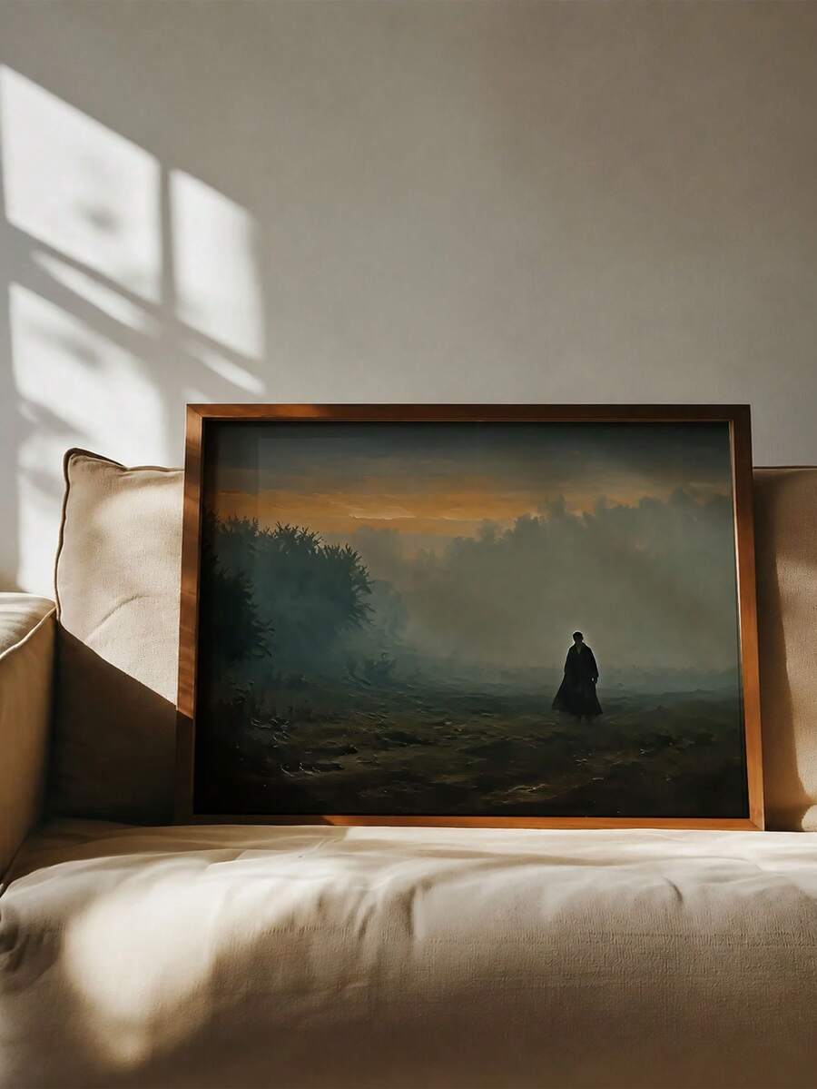 Lone figure in an amber-lit forest displayed above a neutral sofa