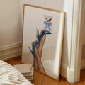 Blue eclectic newspaper fashion wall art with legs, heels, and martini