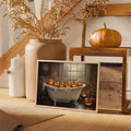 Unframed clawfoot bathtub pumpkin canvas art above an autumn-decorated console table
