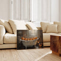 Unframed Halloween bathtub pumpkin print displayed above a beige living-room sofa