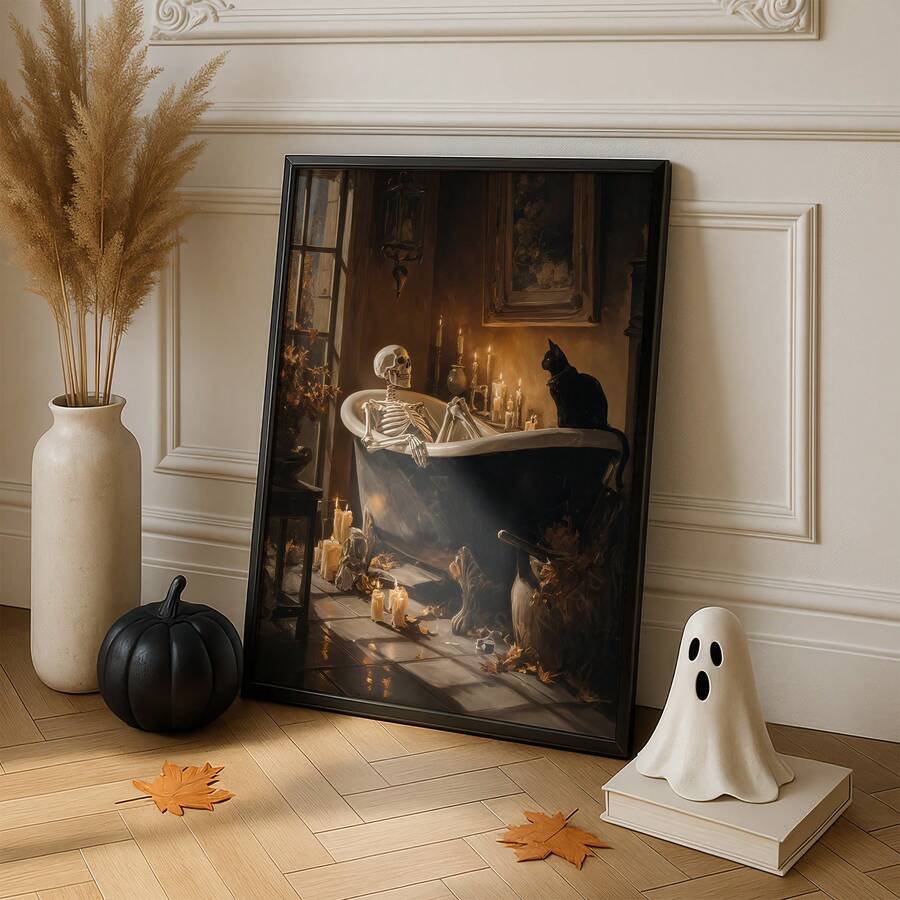 Black-framed skeleton bathtub print leaning against a paneled wall beside a black pumpkin and white ghost decoration