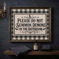 Gothic bathroom wall art in a dark bronze frame beside spooky accessories