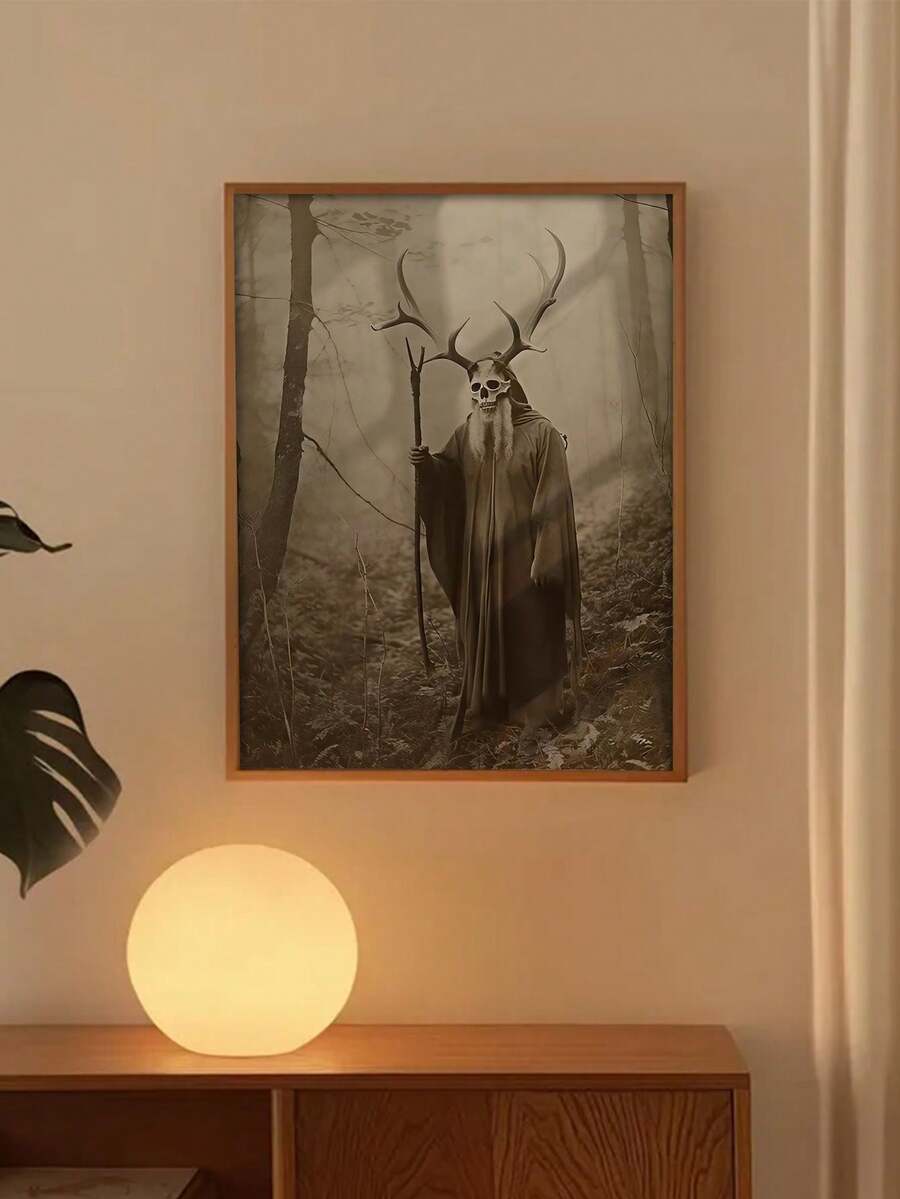 Framed antlered skull figure canvas displayed above a wooden console with a glowing lamp