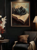 Black dragon sleeping on an open book in a gold frame above dark leather seating