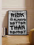 Black and white risk quote poster displayed beside a bright window