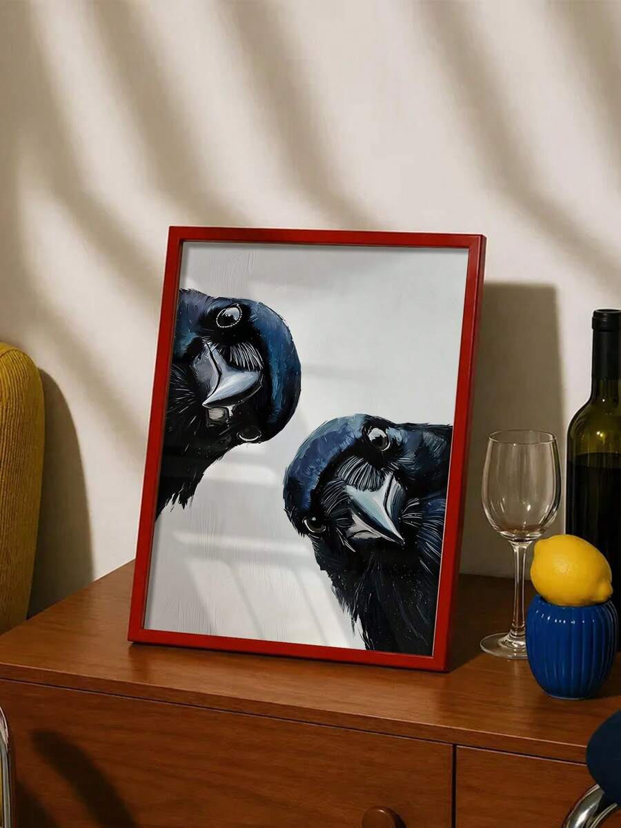 Framed raven and crow canvas wall art styled on a wooden console with a colorful throw