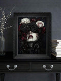 Gothic rose-veiled woman canvas print in a carved black frame above a dresser