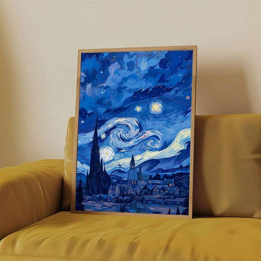 Framed night village canvas displayed on a mustard sofa