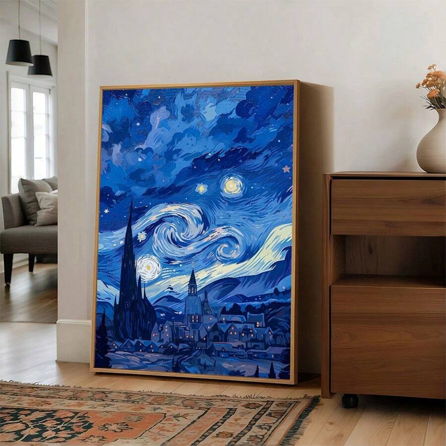Framed swirling sky and village canvas displayed in a bright room