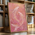 Gold-accented koi artwork leaning beside books in a warm wood bookcase