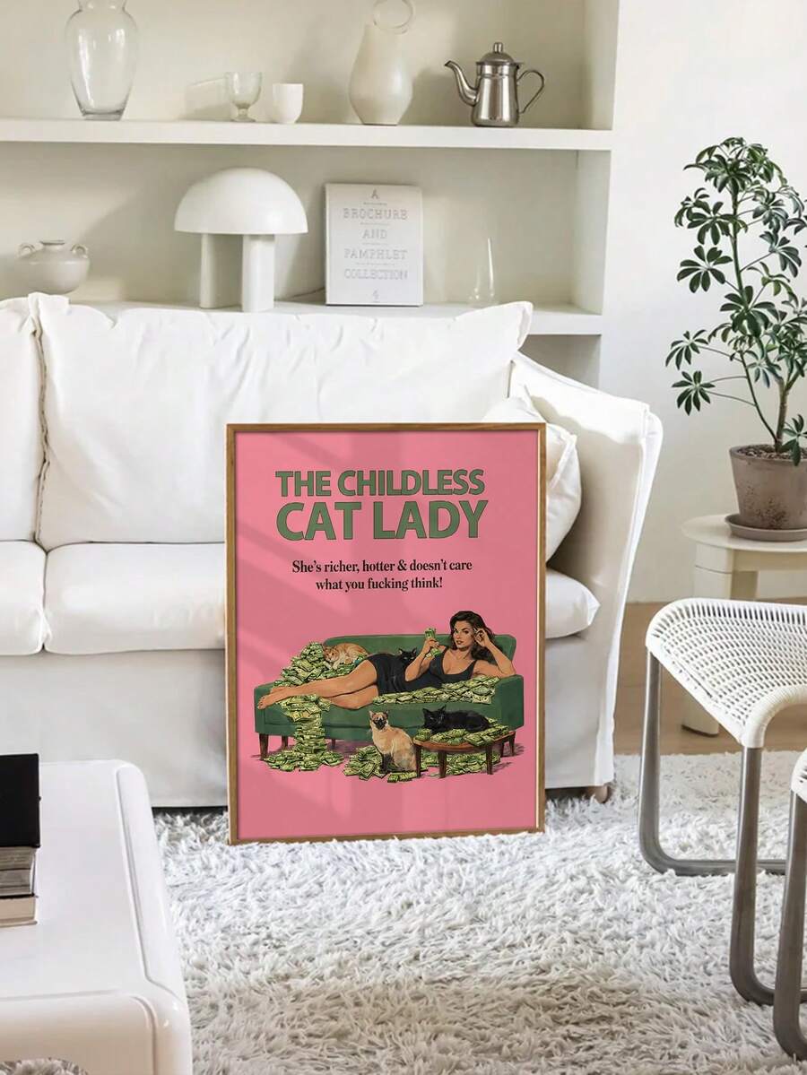 Framed cat lady wall art displayed in front of a white sofa