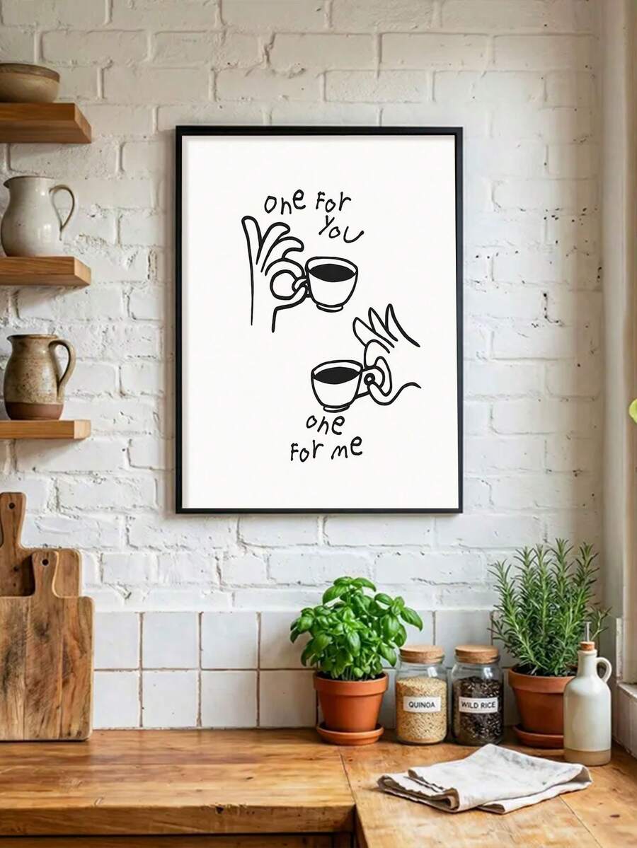Black framed coffee cup line art poster displayed on a white brick kitchen wall
